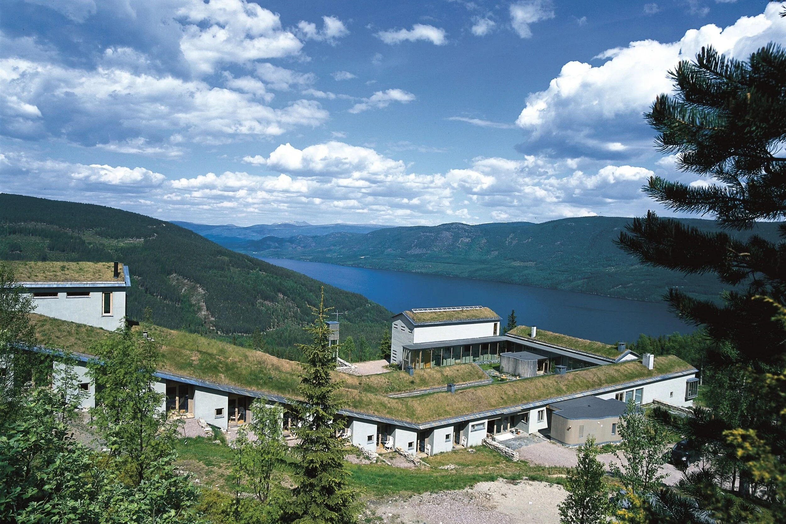 Lia Gård retreat centre with grass roofs above Storsjøen
