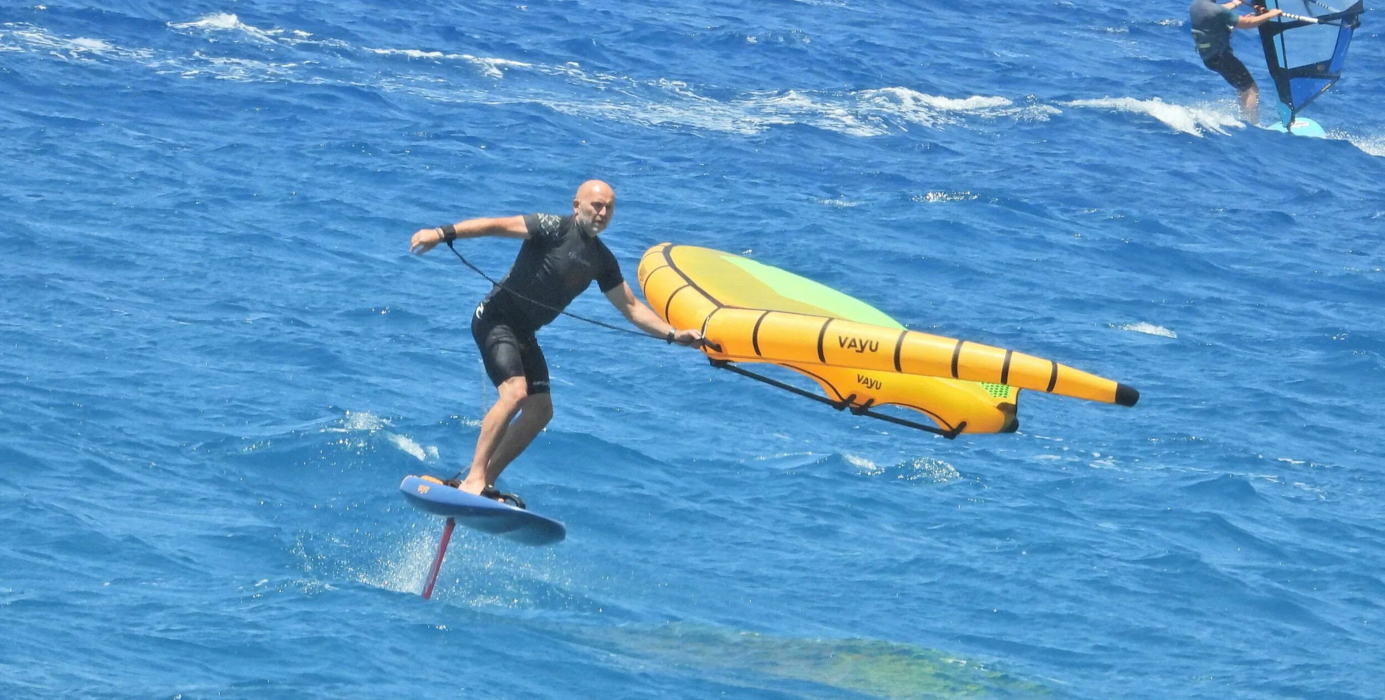 Torkild Skjong wing-foiling on the ocean